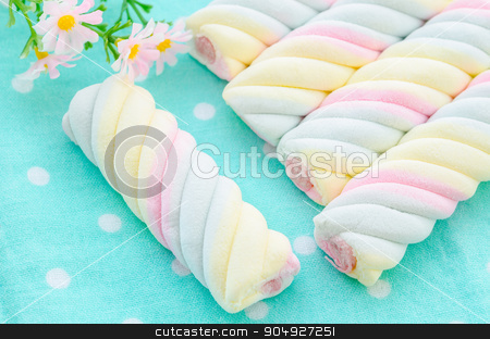To use this stock image in your creative project, please select the size you need over to the right and click the "Add to Cart" button.
Your downloaded image will come with the Cutcaster watermark removed so don’t worry about the watermark you see on this page. Twisted marshmallow. stock photo, Twisted marshmallow with flower on tablecloth. by Miss. PENCHAN PUMILA