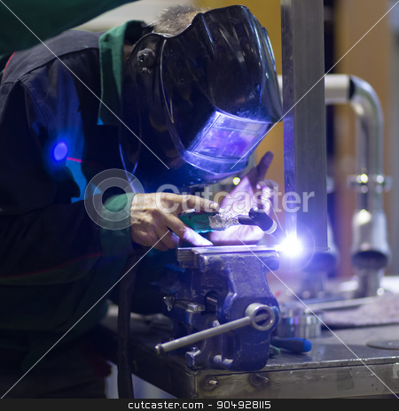 To use this stock image in your creative project, please select the size you need over to the right and click the "Add to Cart" button.
Your downloaded image will come with the Cutcaster watermark removed so don’t worry about the watermark you see on this page. Industrial worker welding in metal factory. stock photo, Industrial worker with protective mask welding inox elements in steel structures manufacture workshop. by kasto