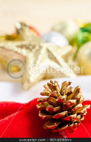 To use this stock image in your creative project, please select the size you need over to the right and click the "Add to Cart" button.
Your downloaded image will come with the Cutcaster watermark removed so don’t worry about the watermark you see on this page. Close up gold pine cones with christmas decorations. stock photo, Close up gold pine cones with christmas decorations on wood background. by Miss. PENCHAN PUMILA