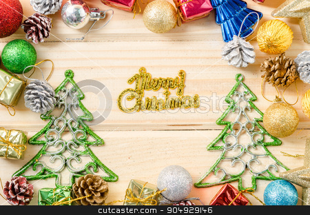 To use this stock image in your creative project, please select the size you need over to the right and click the "Add to Cart" button.
Your downloaded image will come with the Cutcaster watermark removed so don’t worry about the watermark you see on this page. the words merry christmas with christmas decorations. stock photo, the words merry christmas with christmas decorations on wooden background. by Miss. PENCHAN PUMILA