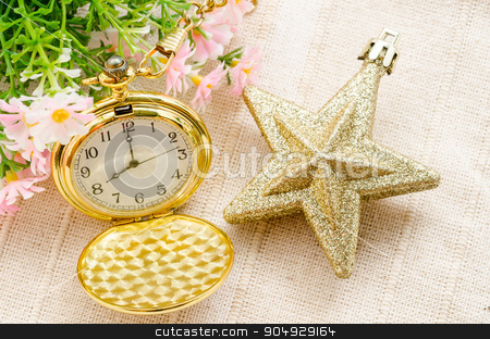 To use this stock image in your creative project, please select the size you need over to the right and click the "Add to Cart" button.
Your downloaded image will come with the Cutcaster watermark removed so don’t worry about the watermark you see on this page. Gold pocket watch and gold star christmas with flower. stock photo, Gold pocket watch and gold star christmas with flower on fabric background. by Miss. PENCHAN PUMILA