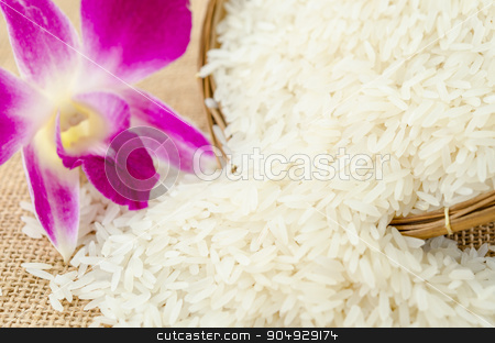 To use this stock image in your creative project, please select the size you need over to the right and click the "Add to Cart" button.
Your downloaded image will come with the Cutcaster watermark removed so don’t worry about the watermark you see on this page. Raw rice with violet orchid flower. stock photo, Raw rice with violet orchid flower in weave basket on sack background. by Miss. PENCHAN PUMILA