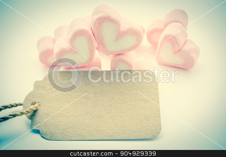 To use this stock image in your creative project, please select the size you need over to the right and click the "Add to Cart" button.
Your downloaded image will come with the Cutcaster watermark removed so don’t worry about the watermark you see on this page. Pink Marshmallow heart shape with blank paper tag. stock photo, Pink Marshmallow heart shape with blank paper tag for your text in vintage style. Love concept. by Miss. PENCHAN PUMILA