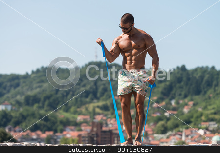 To use this stock image in your creative project, please select the size you need over to the right and click the "Add to Cart" button.
Your downloaded image will come with the Cutcaster watermark removed so don’t worry about the watermark you see on this page. Biceps Exercise Using Resistance Bands stock photo, Handsome Guy Working Out With Rubber Outdoors by Jasminko Ibrakovic