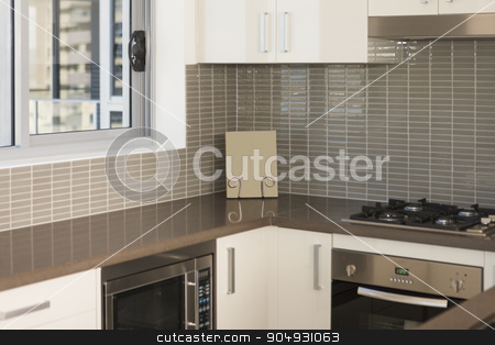 To use this stock image in your creative project, please select the size you need over to the right and click the "Add to Cart" button.
Your downloaded image will come with the Cutcaster watermark removed so don’t worry about the watermark you see on this page. Detail of a modern kitchen stock photo, Detail of a modern kitchen with an oven and a microwave by JRstock