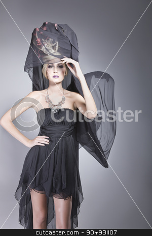 To use this stock image in your creative project, please select the size you need over to the right and click the "Add to Cart" button.
Your downloaded image will come with the Cutcaster watermark removed so don’t worry about the watermark you see on this page. Pretty woman with a long veil stock photo, Pretty woman posing in a short dress and a long black veil, attached to a fashionable hat by JRstock