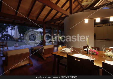 To use this stock image in your creative project, please select the size you need over to the right and click the "Add to Cart" button.
Your downloaded image will come with the Cutcaster watermark removed so don’t worry about the watermark you see on this page. Dining room in late evening stock photo, Modern dining room with a set table and a view to the yard photographed at night by JRstock