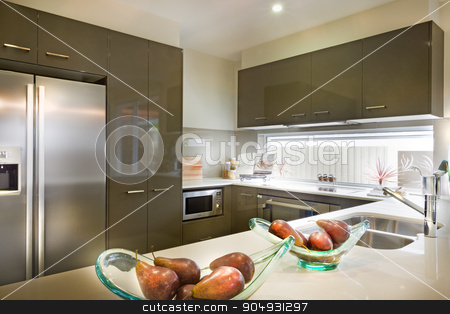 To use this stock image in your creative project, please select the size you need over to the right and click the "Add to Cart" button.
Your downloaded image will come with the Cutcaster watermark removed so don’t worry about the watermark you see on this page. Stylish and modern picture of a kitchen with food placed on shel stock photo, Stylish and modern picture of a kitchen with food placed on shelf and electronic items fixed in wooden outfit by JRstock