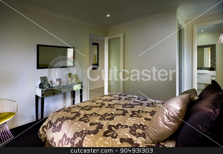 To use this stock image in your creative project, please select the size you need over to the right and click the "Add to Cart" button.
Your downloaded image will come with the Cutcaster watermark removed so don’t worry about the watermark you see on this page. A beautiful bedroom with a bathroom attached and a mrror and tab stock photo, A beautiful bedroom with a bathroom attached and a mrror and table on front of bed with cushion placed on the bed by JRstock