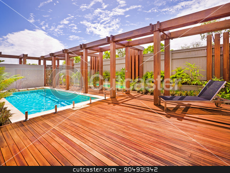To use this stock image in your creative project, please select the size you need over to the right and click the "Add to Cart" button.
Your downloaded image will come with the Cutcaster watermark removed so don’t worry about the watermark you see on this page. A beautiful view of pool in house in a sunny day stock photo, A beautiful view of pool in house in a sunny day with wooden floor with a bench by JRstock