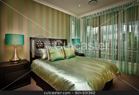 To use this stock image in your creative project, please select the size you need over to the right and click the "Add to Cart" button.
Your downloaded image will come with the Cutcaster watermark removed so don’t worry about the watermark you see on this page. Beautiful image of bedroom stock photo, A beautiful picture of a moody bedroom with golden bedsheet by JRstock