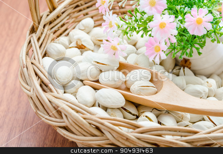 To use this stock image in your creative project, please select the size you need over to the right and click the "Add to Cart" button.
Your downloaded image will come with the Cutcaster watermark removed so don’t worry about the watermark you see on this page. Pistachio nuts in wood basket. stock photo, Pistachio nuts in wood basket and woo spoon with flower on wood background. by Miss. PENCHAN PUMILA