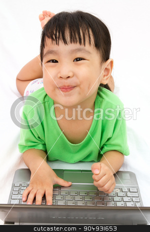 To use this stock image in your creative project, please select the size you need over to the right and click the "Add to Cart" button.
Your downloaded image will come with the Cutcaster watermark removed so don’t worry about the watermark you see on this page. Chinese little girl lying down with laptop stock photo, Chinese little girl lying down with laptop in plain white isolated background. by Tan Kian Khoon