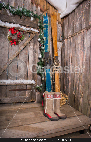 To use this stock image in your creative project, please select the size you need over to the right and click the "Add to Cart" button.
Your downloaded image will come with the Cutcaster watermark removed so don’t worry about the watermark you see on this page. wooden skis standing near the porch stock photo, The old wooden Chalet with a decoration background skiing by zakharovaleksey
