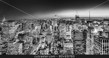 To use this stock image in your creative project, please select the size you need over to the right and click the "Add to Cart" button.
Your downloaded image will come with the Cutcaster watermark removed so don’t worry about the watermark you see on this page. New York City Manhattan downtown skyline. stock photo, New York City. Manhattan downtown skyline with illuminated Empire State Building and skyscrapers at dusk. Black and white image. Panoramic composition. by kasto