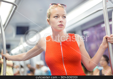 To use this stock image in your creative project, please select the size you need over to the right and click the "Add to Cart" button.
Your downloaded image will come with the Cutcaster watermark removed so don’t worry about the watermark you see on this page. Lady traveling by metro. stock photo, Beautiful blonde caucasian lady in red dress traveling by metro. by kasto
