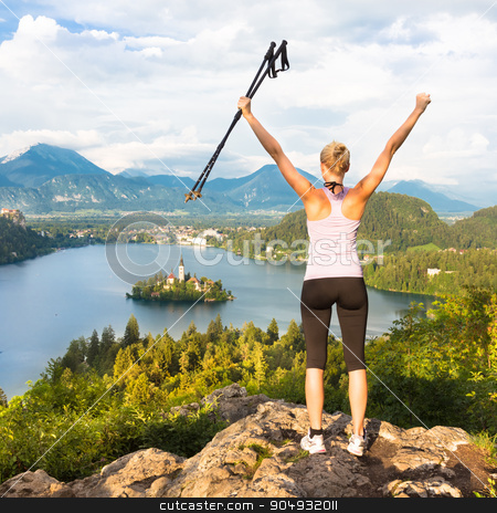 To use this stock image in your creative project, please select the size you need over to the right and click the "Add to Cart" button.
Your downloaded image will come with the Cutcaster watermark removed so don’t worry about the watermark you see on this page. Tracking round Bled Lake in Julian Alps, Slovenia. stock photo, Made it! Young spoty active lady with hiking sticks and hands rised admiring beautiful nature around Bled Lake in Julian Alps, Slovenia. by kasto