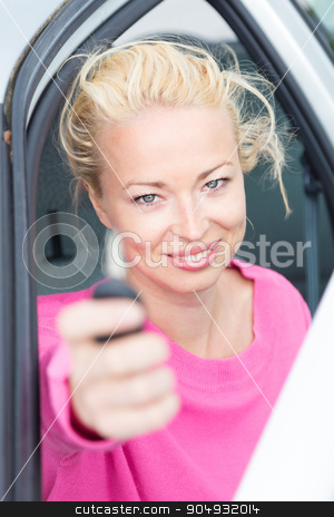 To use this stock image in your creative project, please select the size you need over to the right and click the "Add to Cart" button.
Your downloaded image will come with the Cutcaster watermark removed so don’t worry about the watermark you see on this page. Woman driver showing car keys. stock photo, Woman driver showing car keys. Young female driving happy about her new car or drivers license. Caucasian model. by kasto