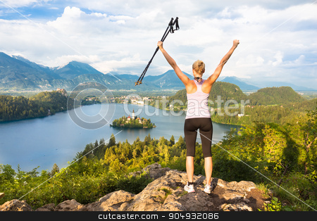 To use this stock image in your creative project, please select the size you need over to the right and click the "Add to Cart" button.
Your downloaded image will come with the Cutcaster watermark removed so don’t worry about the watermark you see on this page. Tracking round Bled Lake in Julian Alps, Slovenia. stock photo, Made it! Young spoty active lady with hiking sticks and hands rised admiring beautiful nature around Bled Lake in Julian Alps, Slovenia. by kasto