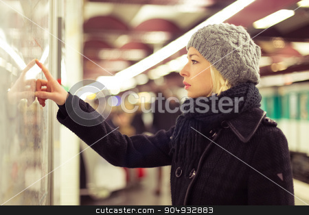 To use this stock image in your creative project, please select the size you need over to the right and click the "Add to Cart" button.
Your downloaded image will come with the Cutcaster watermark removed so don’t worry about the watermark you see on this page. Lady looking on public transport map panel. stock photo, Casually dressed woman wearing winter coat, orientating herself with public transport map panel, pointing on her final destination. Urban transport. by kasto