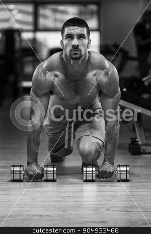 To use this stock image in your creative project, please select the size you need over to the right and click the "Add to Cart" button.
Your downloaded image will come with the Cutcaster watermark removed so don’t worry about the watermark you see on this page. Push Ups With Dumbbels stock photo, Young Athlete Doing Pushups With Dumbbells As Part Of Bodybuilding Training by Jasminko Ibrakovic