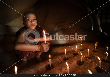 To use this stock image in your creative project, please select the size you need over to the right and click the "Add to Cart" button.
Your downloaded image will come with the Cutcaster watermark removed so don’t worry about the watermark you see on this page. Buddhist novice with candlelight stock photo, Little novice monk hand holding candlelight inside temple, Bagan, Myanmar. by szefei