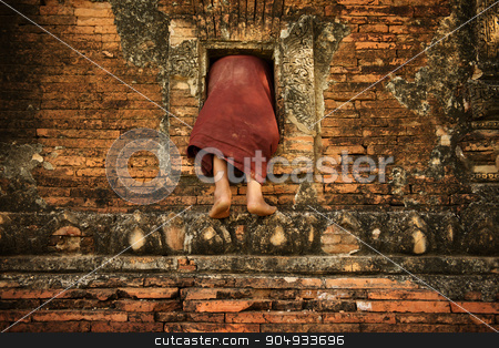 To use this stock image in your creative project, please select the size you need over to the right and click the "Add to Cart" button.
Your downloaded image will come with the Cutcaster watermark removed so don’t worry about the watermark you see on this page. Buddhist novice monk climbing into monastery stock photo, Young novice monks climbing into Buddhist temple from window, Bagan, Myanmar. by szefei