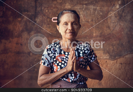 To use this stock image in your creative project, please select the size you need over to the right and click the "Add to Cart" button.
Your downloaded image will come with the Cutcaster watermark removed so don’t worry about the watermark you see on this page. Old Burmese woman stock photo, Portrait of traditional Asian Burmese woman praying, standing inside a temple, low light, Bagan, Myanmar by szefei