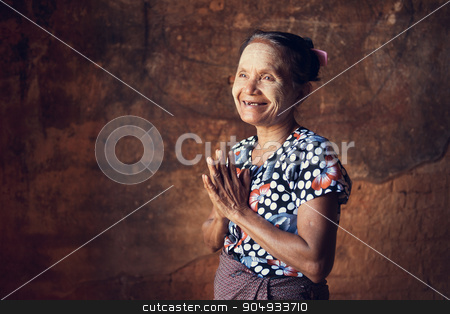 To use this stock image in your creative project, please select the size you need over to the right and click the "Add to Cart" button.
Your downloaded image will come with the Cutcaster watermark removed so don’t worry about the watermark you see on this page. Old Burmese woman stock photo, Portrait of traditional Asian Burmese woman greeting, standing inside a temple, low light, Bagan, Myanmar by szefei