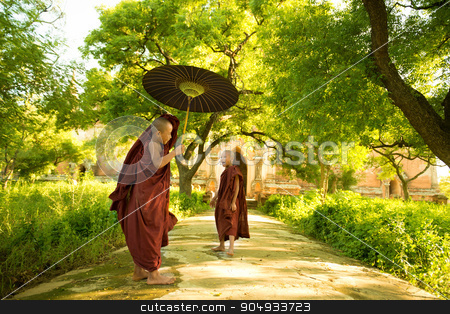 To use this stock image in your creative project, please select the size you need over to the right and click the "Add to Cart" button.
Your downloaded image will come with the Cutcaster watermark removed so don’t worry about the watermark you see on this page. Young Buddhist novice monks stock photo, Two little Buddhist novice monks walking outdoors under shade of green tree, outside monastery, Myanmar. by szefei