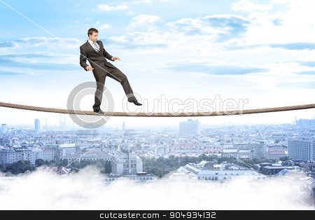 To use this stock image in your creative project, please select the size you need over to the right and click the "Add to Cart" button.
Your downloaded image will come with the Cutcaster watermark removed so don’t worry about the watermark you see on this page. Businessman gently walking on rope stock photo, Businessman gently walking on rope above city with closed eyes by cherezoff