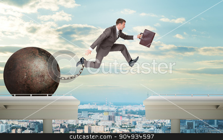 To use this stock image in your creative project, please select the size you need over to the right and click the "Add to Cart" button.
Your downloaded image will come with the Cutcaster watermark removed so don’t worry about the watermark you see on this page. Image of young man jumping over gap stock photo, Image of young businessman with suitcase and iron ballast jumping over gap by cherezoff