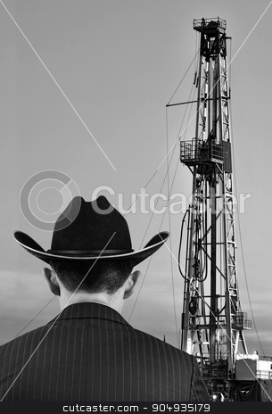 To use this stock image in your creative project, please select the size you need over to the right and click the "Add to Cart" button.
Your downloaded image will come with the Cutcaster watermark removed so don’t worry about the watermark you see on this page. Texas Oil. stock photo, Texas oilman looking at his land prize with room for your type. by WScott