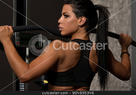 To use this stock image in your creative project, please select the size you need over to the right and click the "Add to Cart" button.
Your downloaded image will come with the Cutcaster watermark removed so don’t worry about the watermark you see on this page. Latino Woman Doing Exercise For Back On Machine stock photo, Sexy Latino Woman Working Out Back On Machine In Fitness Center by Jasminko Ibrakovic