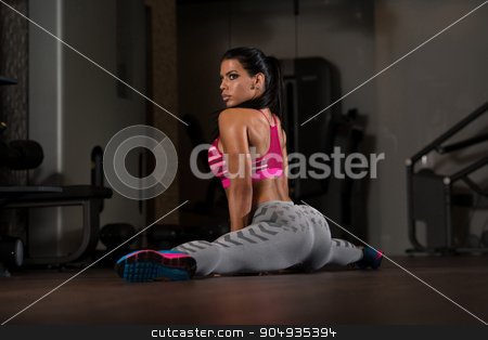 To use this stock image in your creative project, please select the size you need over to the right and click the "Add to Cart" button.
Your downloaded image will come with the Cutcaster watermark removed so don’t worry about the watermark you see on this page. Gym Woman Stretching Legs stock photo, Young Woman Doing Stretching Exercises On The Floor At The Gym by Jasminko Ibrakovic