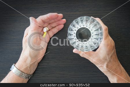 To use this stock image in your creative project, please select the size you need over to the right and click the "Add to Cart" button.
Your downloaded image will come with the Cutcaster watermark removed so don’t worry about the watermark you see on this page. Elderly person taking medication stock photo, Elderly person taking medication, two different pills by michaklootwijk