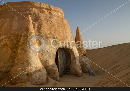 To use this stock image in your creative project, please select the size you need over to the right and click the "Add to Cart" button.
Your downloaded image will come with the Cutcaster watermark removed so don’t worry about the watermark you see on this page. House in the Sahara stock photo, House in the Sahara desert in Tunisia by Ksenija