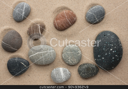 To use this stock image in your creative project, please select the size you need over to the right and click the "Add to Cart" button.
Your downloaded image will come with the Cutcaster watermark removed so don’t worry about the watermark you see on this page. striped stones lying on the sand stock photo, striped stones lying on the sand by alekleks