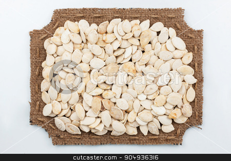 To use this stock image in your creative project, please select the size you need over to the right and click the "Add to Cart" button.
Your downloaded image will come with the Cutcaster watermark removed so don’t worry about the watermark you see on this page. Figured frame of burlap with pumpkin seeds stock photo, Figured frame of burlap with pumpkin seeds, on a white background by alekleks