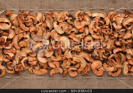 To use this stock image in your creative project, please select the size you need over to the right and click the "Add to Cart" button.
Your downloaded image will come with the Cutcaster watermark removed so don’t worry about the watermark you see on this page. Dried apple lying on sackcloth between the lines stock photo, Dried apple lying on sackcloth between the lines, can be used as background by alekleks