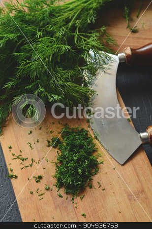 To use this stock image in your creative project, please select the size you need over to the right and click the "Add to Cart" button.
Your downloaded image will come with the Cutcaster watermark removed so don’t worry about the watermark you see on this page. Chopping fresh dill stock photo, Chopping fresh dill with a curved mezzaluna knife by sutike
