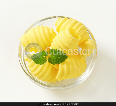 To use this stock image in your creative project, please select the size you need over to the right and click the "Add to Cart" button.
Your downloaded image will come with the Cutcaster watermark removed so don’t worry about the watermark you see on this page. Butter curls stock photo, Curls of fresh butter in glass bowl by Digifoodstock