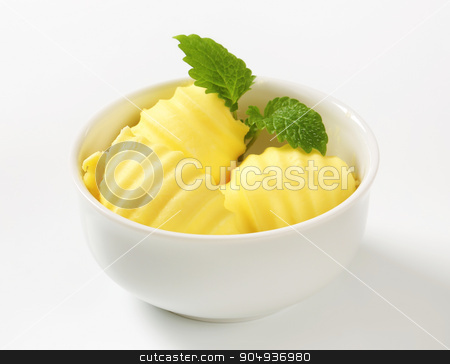To use this stock image in your creative project, please select the size you need over to the right and click the "Add to Cart" button.
Your downloaded image will come with the Cutcaster watermark removed so don’t worry about the watermark you see on this page. Bowl of butter curls stock photo, Curls of fresh butter in glass bowl by Digifoodstock