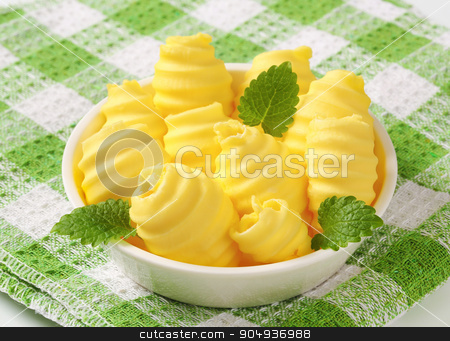 To use this stock image in your creative project, please select the size you need over to the right and click the "Add to Cart" button.
Your downloaded image will come with the Cutcaster watermark removed so don’t worry about the watermark you see on this page. Bowl of butter curls stock photo, Curls of fresh butter in glass bowl by Digifoodstock