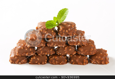 To use this stock image in your creative project, please select the size you need over to the right and click the "Add to Cart" button.
Your downloaded image will come with the Cutcaster watermark removed so don’t worry about the watermark you see on this page. Marzipan pralines stock photo, Marzipan nuggets covered with milk chocolate by Digifoodstock