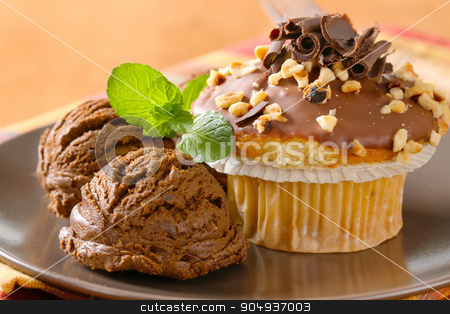 To use this stock image in your creative project, please select the size you need over to the right and click the "Add to Cart" button.
Your downloaded image will come with the Cutcaster watermark removed so don’t worry about the watermark you see on this page. Hazelnut muffin and chocolate ice cream stock photo, Hazelnut muffin with scoops of chocolate ice-cream by Digifoodstock