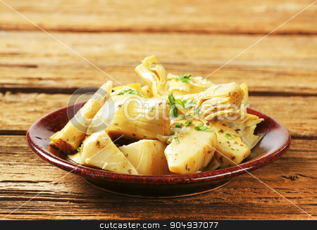 To use this stock image in your creative project, please select the size you need over to the right and click the "Add to Cart" button.
Your downloaded image will come with the Cutcaster watermark removed so don’t worry about the watermark you see on this page. Marinated artichoke hearts stock photo, Artichoke hearts dressed in oil and herb marinade by Digifoodstock