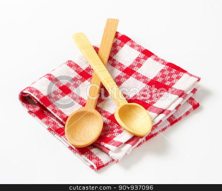 To use this stock image in your creative project, please select the size you need over to the right and click the "Add to Cart" button.
Your downloaded image will come with the Cutcaster watermark removed so don’t worry about the watermark you see on this page. Checked tea towel and wooden spoons stock photo, Red and white tea towel and wooden spoons by Digifoodstock