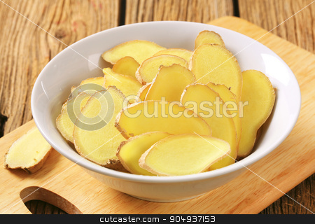 To use this stock image in your creative project, please select the size you need over to the right and click the "Add to Cart" button.
Your downloaded image will come with the Cutcaster watermark removed so don’t worry about the watermark you see on this page. Fresh ginger slices stock photo, Fresh ginger root - thinly sliced by Digifoodstock