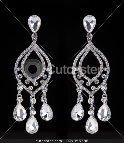 To use this stock image in your creative project, please select the size you need over to the right and click the "Add to Cart" button.
Your downloaded image will come with the Cutcaster watermark removed so don’t worry about the watermark you see on this page. earrings with jewels on the black stock photo, Silver earrings with jewels on the black by Kopytin Georgy
